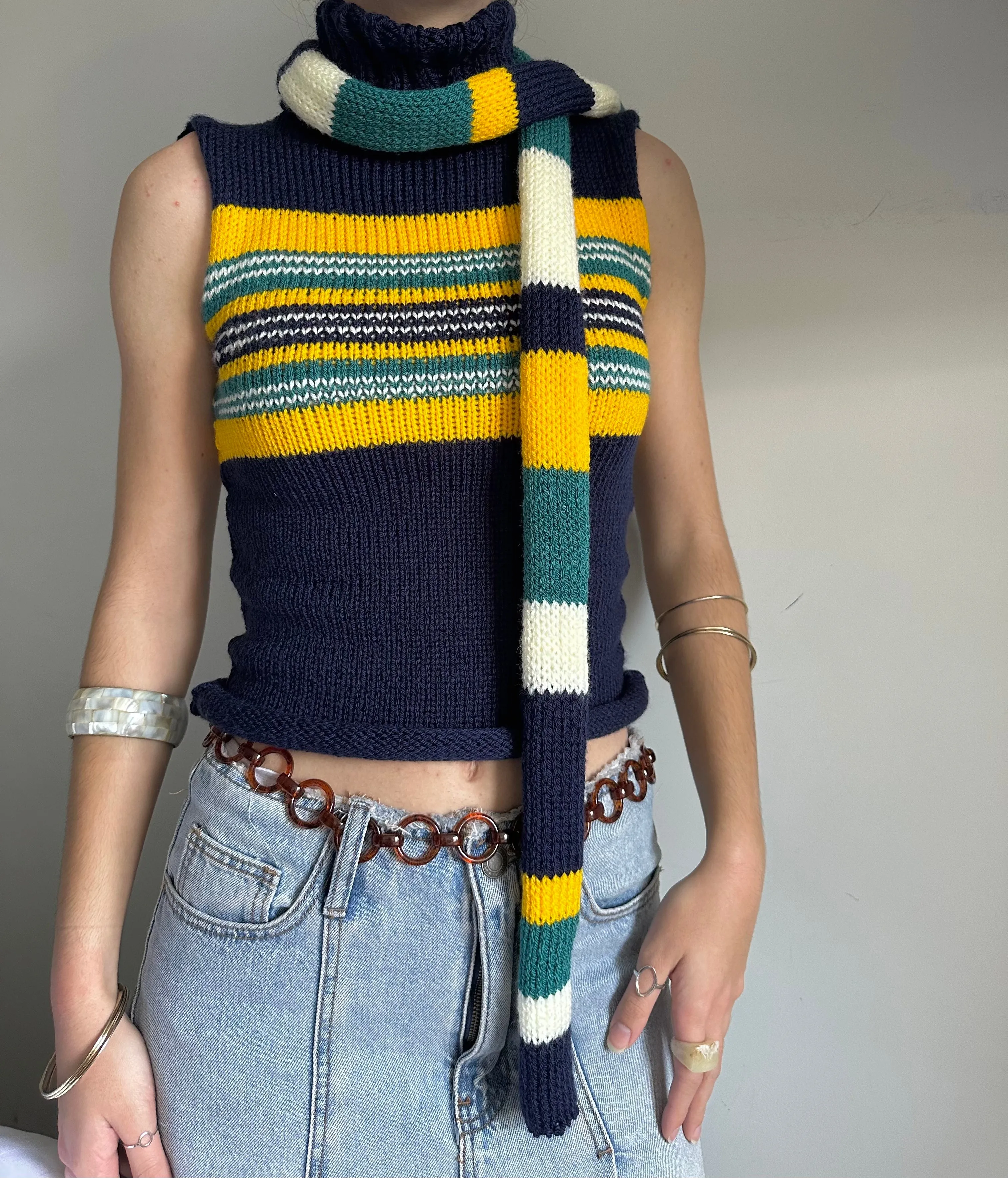 Handmade knitted stripy skinny scarf in navy, cream, yellow and teal