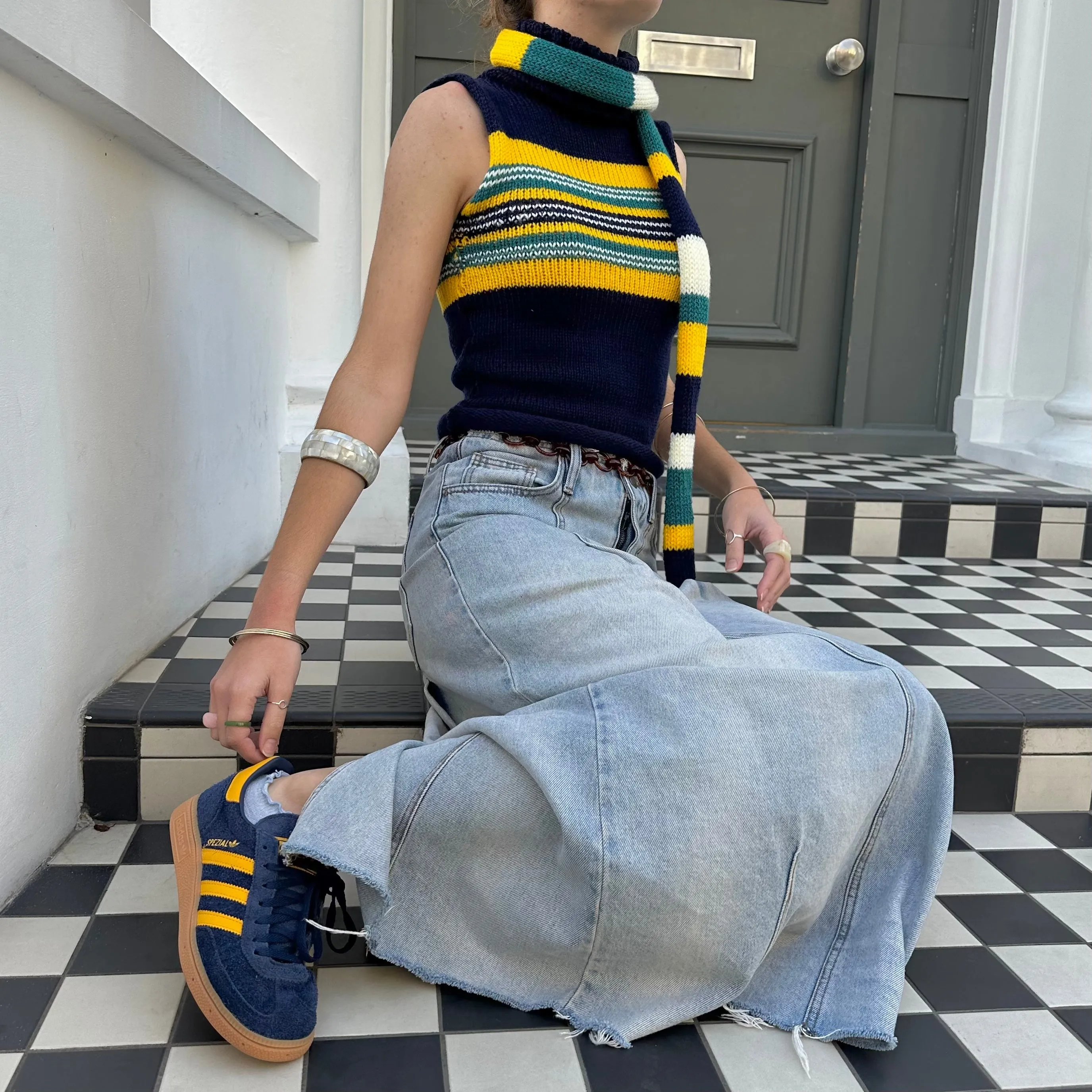 Handmade knitted stripy skinny scarf in navy, cream, yellow and teal