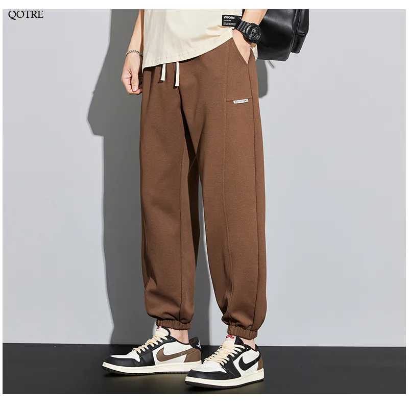 Tapered Knitted Slant Pocket Solid Color Sweatpant