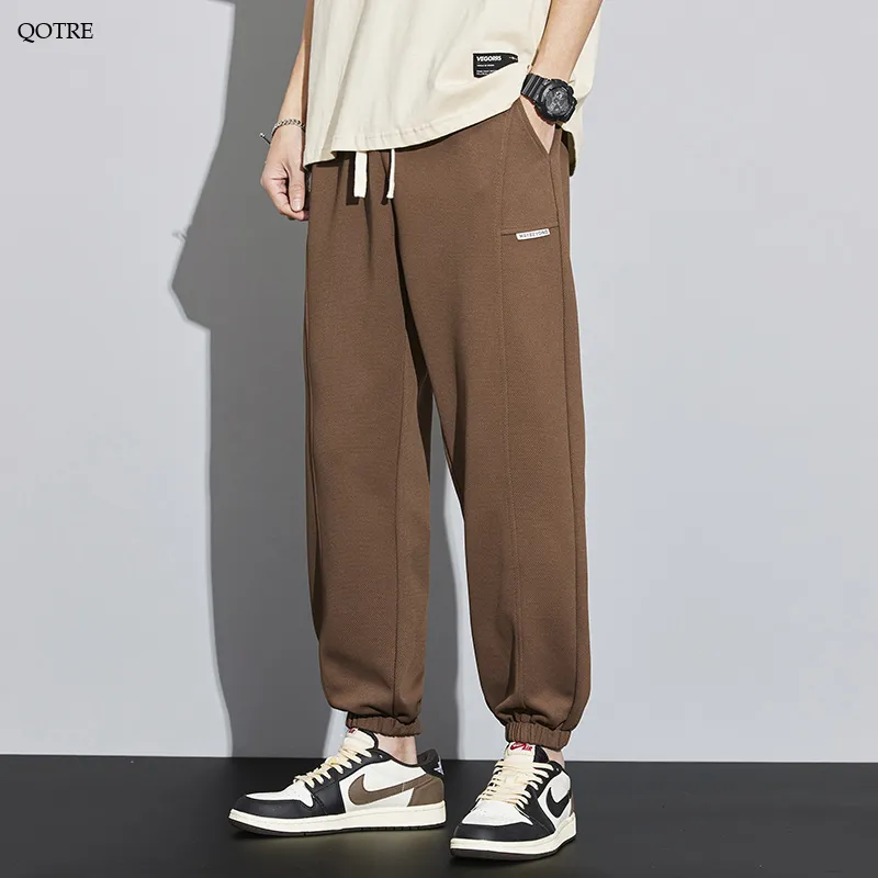 Tapered Knitted Slant Pocket Solid Color Sweatpant